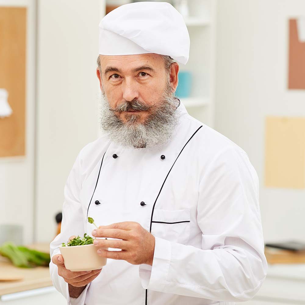 professional-chef-posing-in-kitchen-73YN8D2.jpg
